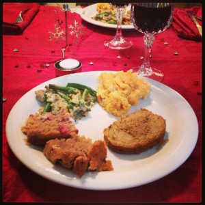 Full plate on a beautiful table - cranberry bread, modified green bean casserole, mashed potatoes, Field Roast... wine. :)